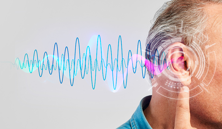 A senior resident with low vision being guided gently by a caregiver down a high-contrast hallway in a Sensory-friendly senior living in India facility.